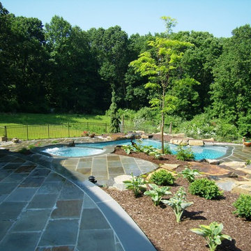 Delaware Township custom pool and raised spa with negative edge & water feature