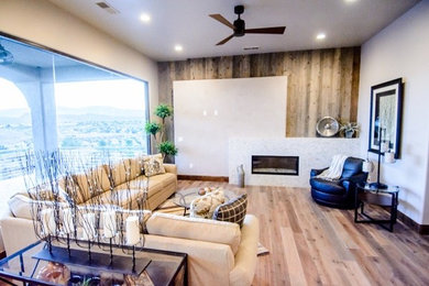 Example of a mid-sized transitional open concept light wood floor and beige floor living room design in Salt Lake City with white walls and no fireplace