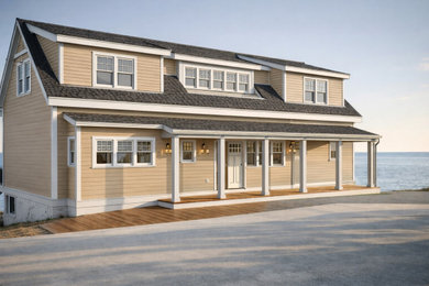 Mid-sized beach style two-story wood and shingle exterior home photo in Boston