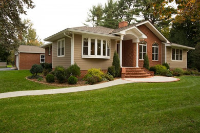 Inspiration for a large craftsman beige one-story concrete fiberboard exterior home remodel in Baltimore with a hip roof