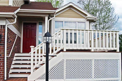 Inspiration for a small timeless front porch remodel in Denver with a roof extension