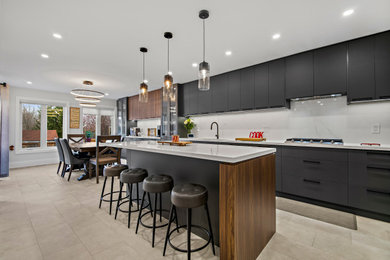 Inspiration for a contemporary galley porcelain tile and beige floor eat-in kitchen remodel in Toronto with an undermount sink, flat-panel cabinets, gray cabinets, quartzite countertops, white backsplash, stone slab backsplash, stainless steel appliances, an island and white countertops