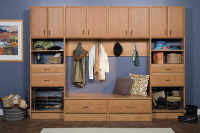Dressing room - mid-sized contemporary gender-neutral dressing room idea in Seattle with flat-panel cabinets and light wood cabinets