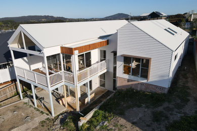 Photo of a contemporary home design in Wollongong.