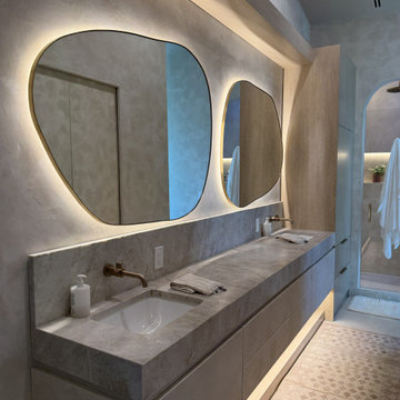 Microcement, Stone, and Bronze Bathroom in St Pete Beach