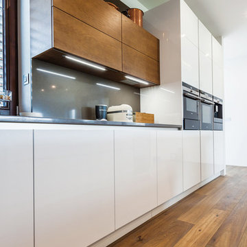 White modern kitchen with walnut veneer