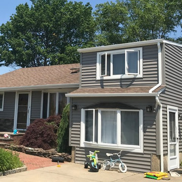 Hicksville Siding - Storm Clapboard Siding with Versetta Sterling Ledgestone