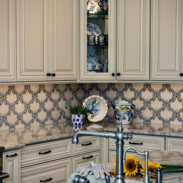 Creamy Yellow Paneled Cabinets & Handmade Tile Backsplash