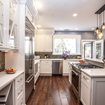 Transitional White Kitchen Remodel | Glass Display Cabinets & Custom Island