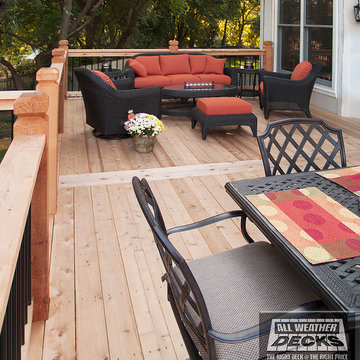 Leeder - Cedar deck in Kansas City with stamped concrete patio and firepit.