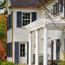 Blue Shutters white painted brick