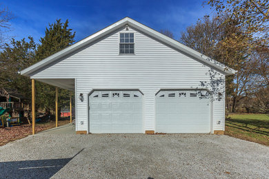Garage - cottage garage idea in Cleveland