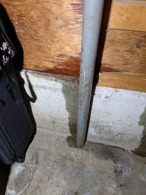 Water leaking through Garage walls and door. Who should I contact?