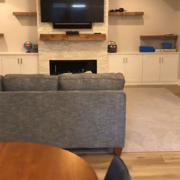 Basement Entertainment center with toy storage cabinets