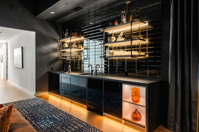 Minimalist home bar photo in Austin with black cabinets