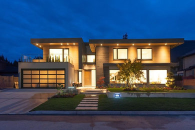 This is an example of a large contemporary home design in Vancouver.