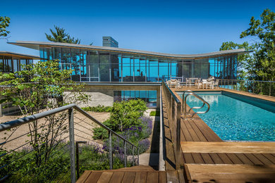 Example of a trendy glass flat roof design in Chicago