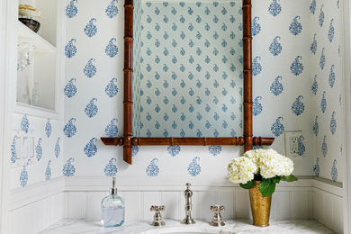 Powder room - coastal mosaic tile floor, white floor and wallpaper powder room idea in Los Angeles with white cabinets, multicolored walls, an undermount sink, white countertops and a floating vanity