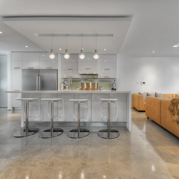 White Kitchen with Concrete Flooring