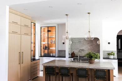 Inspiration for a mid-sized transitional l-shaped eat-in kitchen remodel in Charlotte with shaker cabinets, medium tone wood cabinets and an island