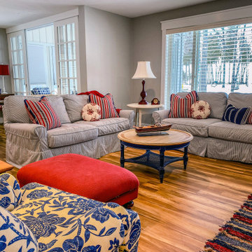 Slipcovered Sofas and Blue Print Chairs Red Ottoman