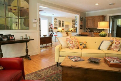 Mid-sized mid-century modern open concept light wood floor living room photo in New Orleans with gray walls, no fireplace and a media wall