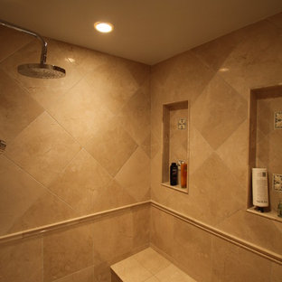 Example of a mid-sized classic master beige tile and stone tile marble floor bathroom design in DC Metro with an undermount sink, raised-panel cabinets, light wood cabinets, granite countertops, a two-piece toilet and gray walls