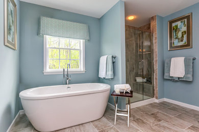 Bathroom - mid-sized contemporary master beige tile and ceramic tile ceramic tile and beige floor bathroom idea in Philadelphia with blue walls and a hinged shower door