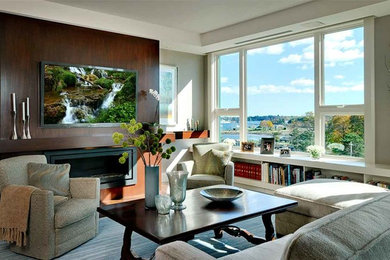 Living room - mid-sized contemporary formal and enclosed medium tone wood floor and brown floor living room idea in DC Metro with beige walls, a ribbon fireplace, a metal fireplace and a wall-mounted tv