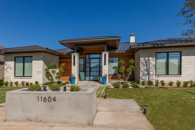 Trendy white one-story mixed siding exterior home photo in Austin with a hip roof
