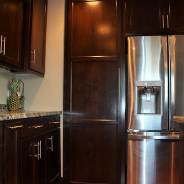 Staggered Kitchen Cabinets with Hidden Pantry