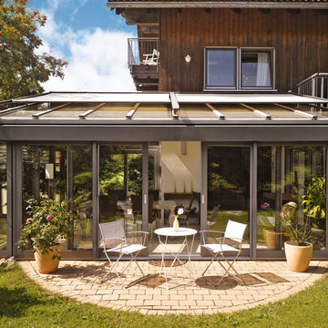 Wintergarten in grau, rustikal eingerichtet