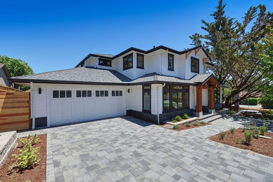 Large farmhouse white two-story wood house exterior photo in San Francisco with a hip roof and a shingle roof
