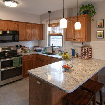 Bathroom/Laundry Room Using Warmer Tones, Accented by New Laundry Facility