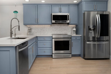 Example of a beach style kitchen design in Other