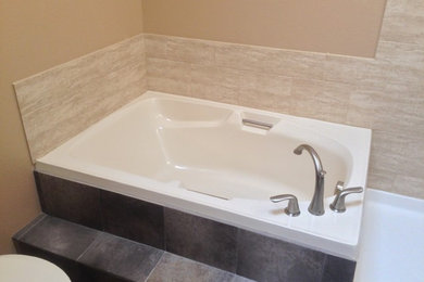 Bathroom - mid-sized traditional master beige tile and porcelain tile porcelain tile bathroom idea in Denver with beige walls
