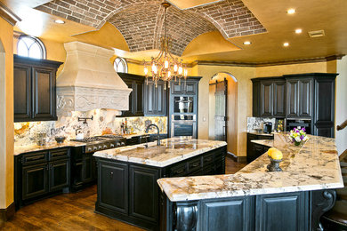 Inspiration for a mediterranean kitchen remodel in Houston with granite countertops