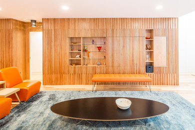 Large mid-century modern formal and open concept light wood floor living room photo in Austin with white walls and no fireplace