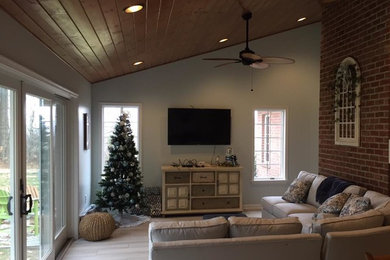 Inspiration for a transitional enclosed family room remodel in Other with blue walls