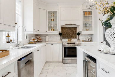 Large elegant ceramic tile and white floor kitchen photo in Montreal with an undermount sink, shaker cabinets, white cabinets, quartz countertops, white backsplash, mosaic tile backsplash, stainless steel appliances and white countertops