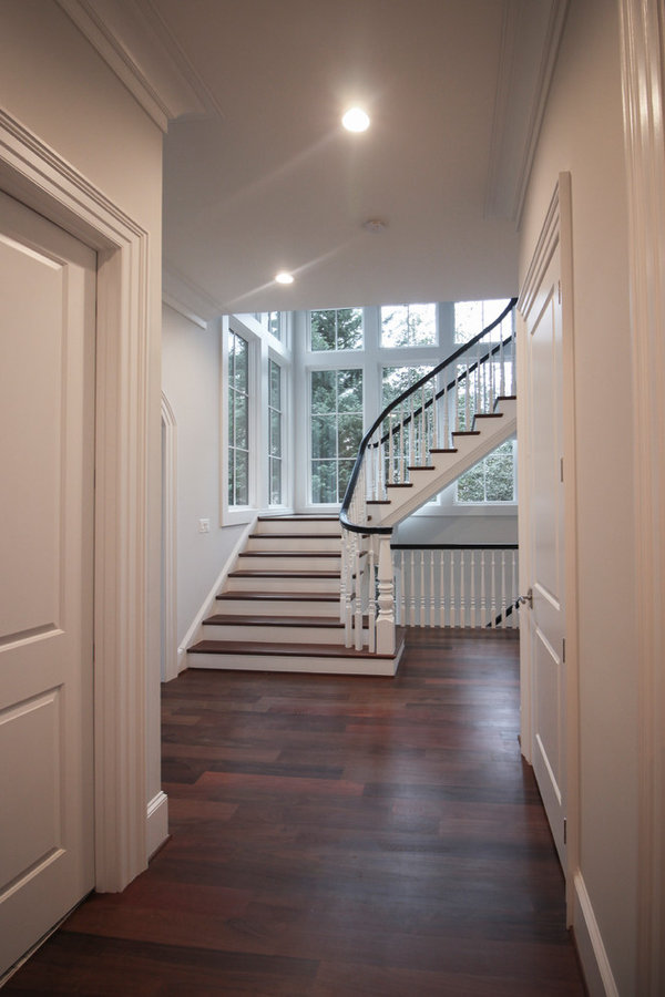 Powerful Impression by Floating Staircase in Suburban Foyer