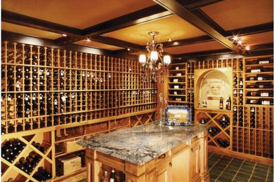 Large elegant ceramic tile wine cellar photo in Orange County