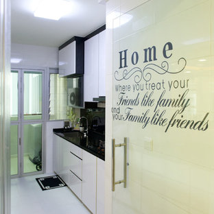 Contemporary kitchen pantry pictures - Trendy kitchen pantry photo in Singapore with a single-bowl sink, flat-panel cabinets, white cabinets and black backsplash