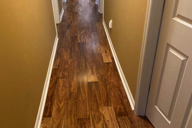 Example of a classic dark wood floor hallway design in Raleigh