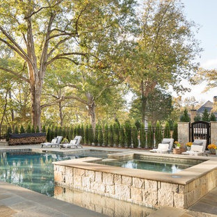 アトランタの大きいオーダーメイドカントリー風おしゃれなプール (天然石敷き) の写真