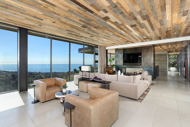 Inspiration for a large contemporary formal and open concept porcelain tile and beige floor living room remodel in Orange County with a two-sided fireplace, a metal fireplace and a media wall