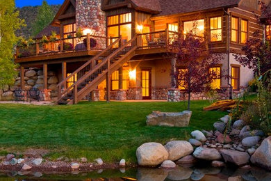 Inspiration for a mid-sized rustic brown two-story wood exterior home remodel in Denver