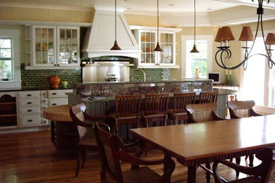 Inspiration for a medium sized farmhouse kitchen/dining room in Los Angeles with yellow walls, medium hardwood flooring, no fireplace and brown floors.
