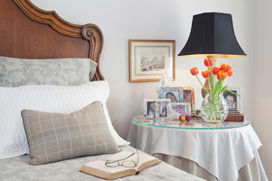Elegant master carpeted bedroom photo in Austin with gray walls