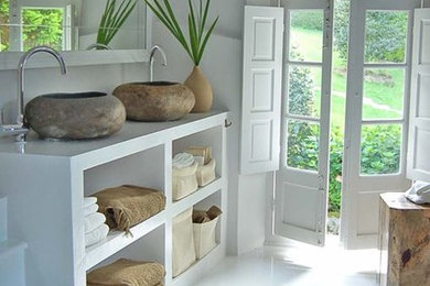Inspiration for a mid-sized mediterranean master porcelain tile bathroom remodel in Los Angeles
